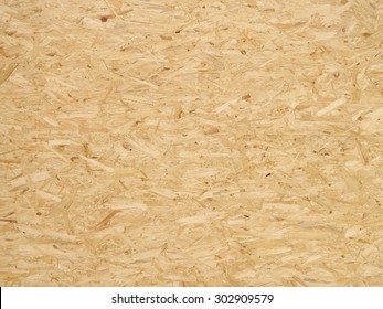 Pressed wooden panel background, seamless texture of oriented strand board - OSB - Shutterstock ID 302909579
