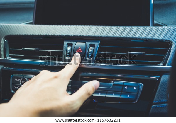 Presses the\
emergency stop in the car by hand of\
man