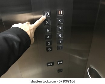 Pressing The Button In The Elevator