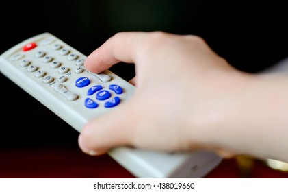 Pressing The Button On The TV Remote Control.
TV Remote Control - Close Up.