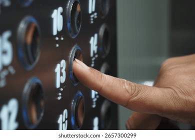 Pressing the elevator button for the 13th floor