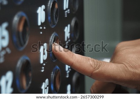 Pressing the elevator button for the 13th floor