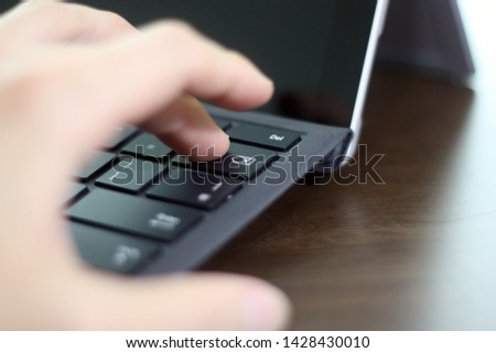 Pressing keyboard's backspace button with a finger
