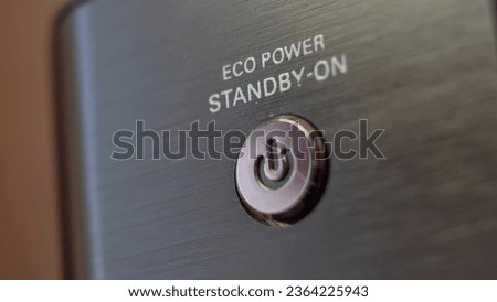 Pressing Stand By Power Button Close-Up