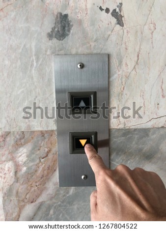 Pression down an elevator buttom