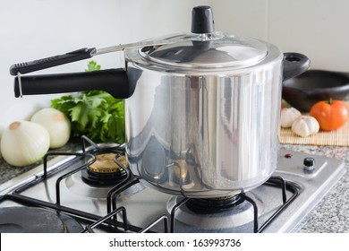 Pressure Cooker in a Kitchen setting - Shutterstock ID 163993736