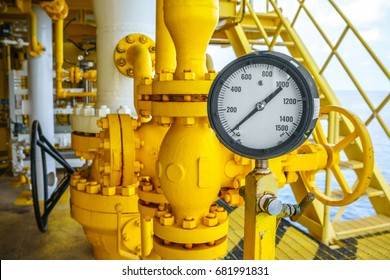 Pressure gauge for monitoring measure pressure production process, Rig oil and gas or petroleum on offshore wellhead platform in the gulf or the sea, Energy and petroleum industry is major of world.