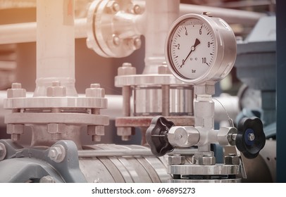 Pressure gauge on discharge pump in industrial plant, Oil and gas pressure gauge in factory