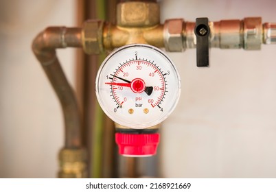 Pressure gauge on a sealed central heating system in a UK home - Shutterstock ID 2168921669