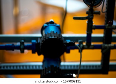 Pressure Gauge Psi Meter In Pipe And Valves Of Water System Industrial Focus Left Closeup White Light Defocus Blur Background.