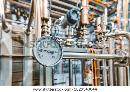 Pressure gauges mounted on the pipeline. Measuring instruments for pressure control.