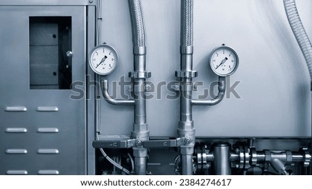 Pressure gauges mounted on the pipeline. Measuring instruments for pressure control. Industrial concept