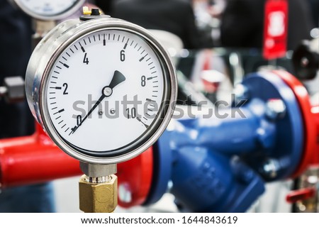pressure manometer for measuring installed in water or gas systems. focus on the pressure manometer. Plumbing equipment, fittings, pipes, faucets, etc.