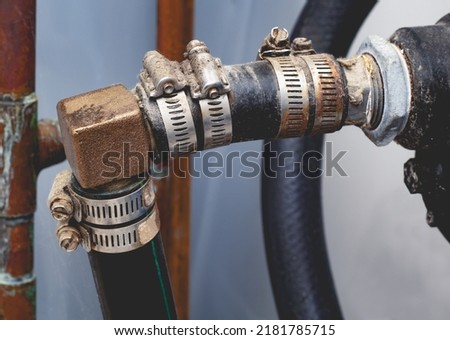 Pressure pump plumbing including hoses, clamps and ninety degree elbow