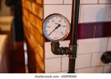 the pressure sensor in the pipeline, on the background tiles