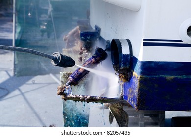 pressure washer cleaning boat hull barnacles antifouling and seaweed