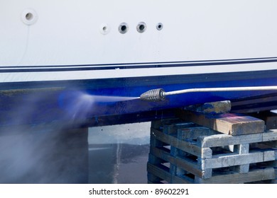 pressure washer cleaning boat hull barnacles antifouling and seaweed
