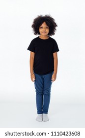 Pre-teen African American kid in casual style standing still isolated in white background