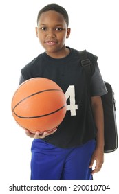 A Preteen Athlete Carrying His Gym Bag While Holding Out His Basketball In An Invitation To Play.  On A White Background.