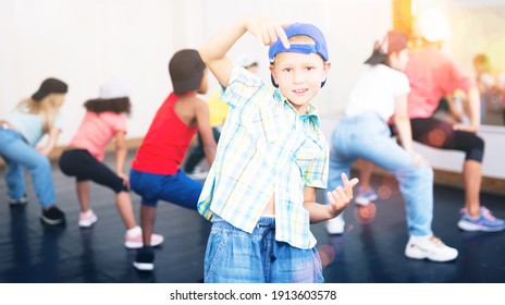 Preteen Boy In Cap Performing Hip-hop At Group Dance Class