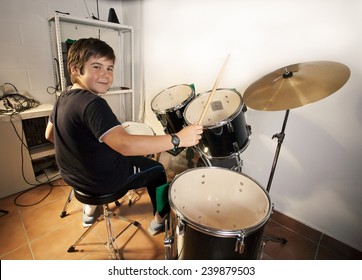 Preteen Boy Happily Playing Drums