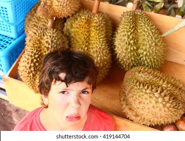 Preteen Boy Smell Durian - Tropical Fruit With Good Taste But Bad Smell