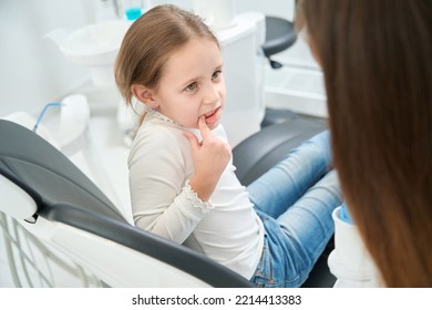 Pre-teen Girl Complaining Of Toothache To Doctor