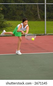 Preteen Girl Playing Tennis