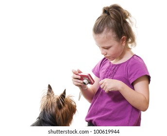 Preteen Girl Taking Photo Of Pet Dog