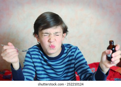 Preteen Handsome Boy Make A Grimace After Taking Bitter Medicine