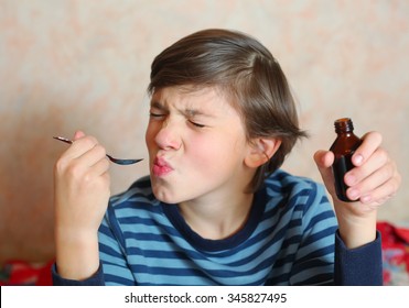 Preteen Handsome Boy Make A Grimace After Taking Bitter Medicine