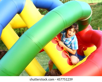 preteen happy boy in outdoor  amusement park attraction inflated ball close up laughing portrait - Shutterstock ID 457751239