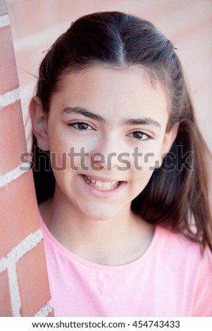 Similar – Adorable preteen girl with plants of background