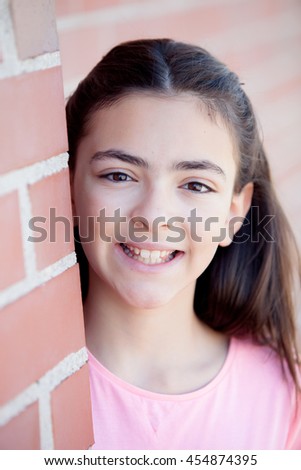 Similar – Adorable preteen girl with plants of background