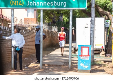 Pretoria, Gauteng, South Africa, April 24 2020, People Next To Road During Corona Virus Lockdown Covid-19 Pandemic Looking For Work Posted Paper On Wall Out Of Focus With Grian