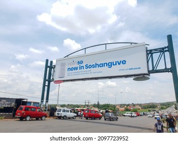 Pretoria, Soshanguve, Gauteng, South Africa - December 22, 2021: An Overhead Billboard On A Freeway Advertising Rain's New 5G And Router Promotion 