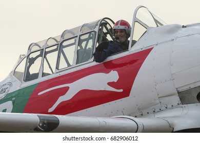 PRETORIA, SOUTH AFRICA-MAY 6 2017: A Display Pilot From The Puma Energy Flying Lions Aerobatic Team  Taxis A Harvard Past The Crowd Line At The Swartkops Museum Airshow