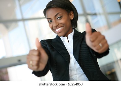 A Pretty African American Business Woman With Thumbs Up