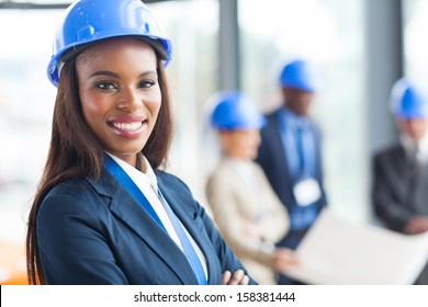 Pretty African American Female Construction Worker In Office