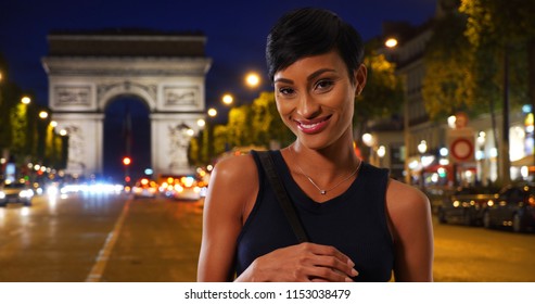 Pretty African American Woman With Her Purse Enjoying Nightlife In Paris France