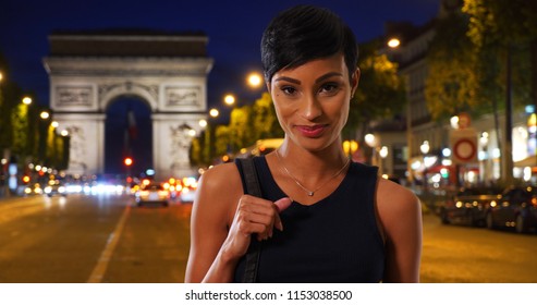 Pretty African American Woman With Her Purse Enjoying Nightlife In Paris France