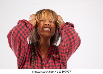 Pretty African American woman in red plaid shirt, pulling her hair in anger or frustration