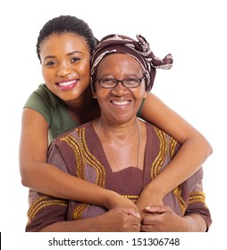 pretty african daughter hugging her senior mother over white background