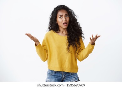 Pretty african-american woman pissed-off looking outraged, raise hands in dismay, complaining and arguing, talking troubled uneasy, stare camera angry, standing white background - Shutterstock ID 1535690909