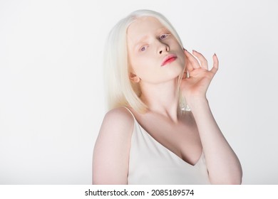 Pretty Albino Model In Dress Looking At Camera Isolated On White