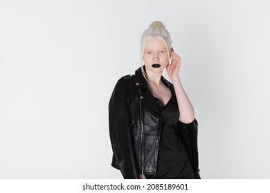 Pretty Albino Model In Leather Jacket Posing Isolated On White