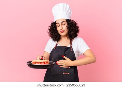 pretty arab woman barbecue chef preparing hot dogs