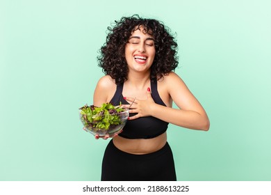 Pretty Arab Woman Laughing Out Loud At Some Hilarious Joke And Holding A Salad. Diet Concept