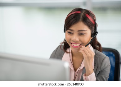 Pretty Asian Help Desk Manager In A Headset