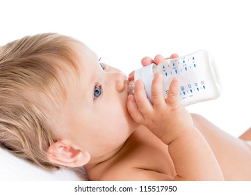 Pretty Baby Girl Drinking Milk From Bottle